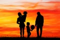 Joyful family at sunset