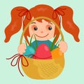 Happy little girl holding a basket of easter and colorful eggs. Royalty Free Stock Photo