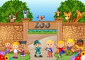 Kids playing at the zoo with zookeeper and animal Royalty Free Stock Photo