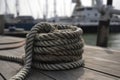 illustration, knot tied with metallic marine rope in nautical port, ai generative