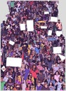 Illustration of large marching crowd protest with blank signs banners