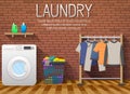 Laundry room with washing machine, drying clothes and clothes basket on brick wall background