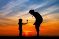 Little girl catches a flower for her mother