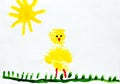 Illustration made by child of chicken on grass under sun