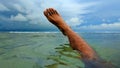 Man foot out of water in Sundak beach in Gunung Kidul, Yogyakarta, Indonesia. Royalty Free Stock Photo