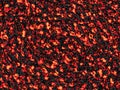 Material texture of red hot embers surrounded by ashes Royalty Free Stock Photo