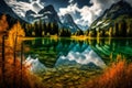 Mountain lake with autumn forest and reflection in water, Dolomites, Italy Royalty Free Stock Photo