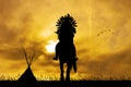 Native American Indian On Horseback At Sunset