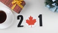 Illustration, new year, male hand changes the year from 2017 to 2018, Canada flag, cauntry ball.