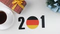 Illustration, new year, male hand changes the year from 2017 to 2018, German flag, cauntry ball.