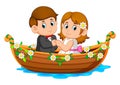 The couple are posing on the beautiful boat with the flowers around it