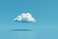 One white cloud floating in the sky against a solid blue background in a simple minimalistic style reminiscent of stop motion ani Royalty Free Stock Photo