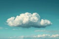 One white cloud floating in the sky, simple and minimalistic with a pastel blue background Royalty Free Stock Photo