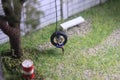 Illustration Photo, Gadget Freak or addicted, Sitting Man Holding Smartphone at swinging from used car tire in the yard Royalty Free Stock Photo