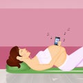 Pregnant woman listens to music