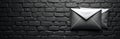 Illustration presents vintage silver envelopes against a dark brick wall. The contrast creates unique visual effect. Concept Royalty Free Stock Photo
