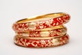 illustration of red and gold bangles from India white background, Generative ai Royalty Free Stock Photo