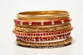 illustration of red and gold bangles from India white background, Generative ai Royalty Free Stock Photo