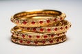 illustration of red and gold bangles from India white background, Generative ai Royalty Free Stock Photo