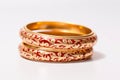 illustration of red and gold bangles from India white background, Generative ai Royalty Free Stock Photo