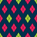 illustration of seamless diamond pattern with pink and green colors on a dark saturated blue background.