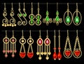 set of jewelry gold earrings with chains and precious stones Royalty Free Stock Photo