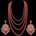 set of multi-layered ruby beads with diamonds and earrings of Indian jewelry designs Royalty Free Stock Photo