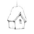 Small bird house with snow on the roof Royalty Free Stock Photo