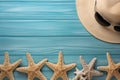 Illustration for summer vacation of a Hat, glasses, and starfish on a blue wooden background, in the style of serene seascapes.