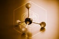 Illustration of tetrahedral molecular geometry with brown background..