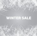 Illustration of the text winter sale with the frosted glass window with the traces of frost, snow, ice, snowflakes. Royalty Free Stock Photo