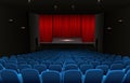 Theater stage with red curtains and blue seats Royalty Free Stock Photo