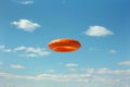 There is an orange freese flying in the air, high quality, high resolution Royalty Free Stock Photo