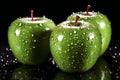 Three green apples with water drops on black background, close-up Royalty Free Stock Photo