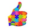 Illustration of a thumbs up sign composed of colorful puzzle pieces on a white background