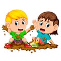 Two kids playing in the mud Royalty Free Stock Photo