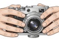 Illustration of a vintage camera held by two hands. The camera Royalty Free Stock Photo