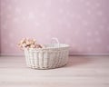 illustration of white wicker basket with white furry cover for people or product placement , pink background , created with ai Royalty Free Stock Photo