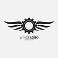 Winged gear black icon on black background Royalty Free Stock Photo