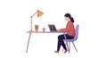 Female programmer working remotely at desk with laptop and lamp, coding software development Royalty Free Stock Photo