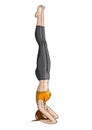 Girl doing yoga headstand (Shirshasana)