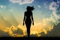 Woman walks with hair in the wind at sunset