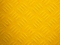 a yellow painted diamond metal plate texture