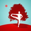 yoga standing pose in front of a tree