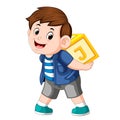 Young boy playing alphabet block