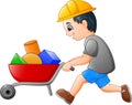 Young builder worker pushing a wheelbarrow