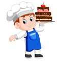 Young chef holds a tray with cake