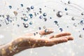 Illustrative big data and cybersecurity blockchain floating above a hand