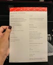 Illustrative editorial brochure menu on economy class of Qantas Airlines