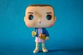 Illustrative editorial of Funko Pop action figure of Eleven with eggos waffles, fictional character from the Netflix series Strang